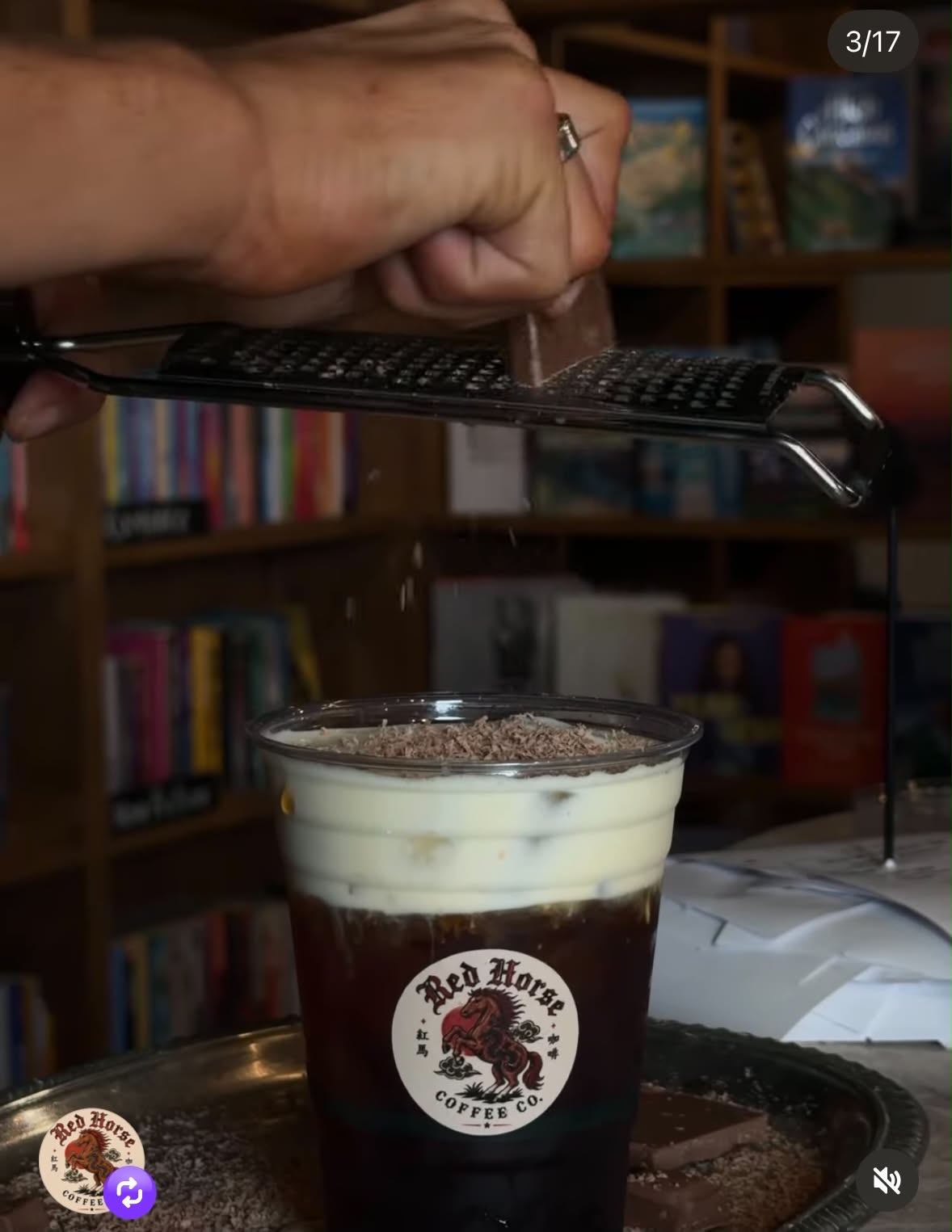 Fresh cream being poured over a Red Horse iced coffee