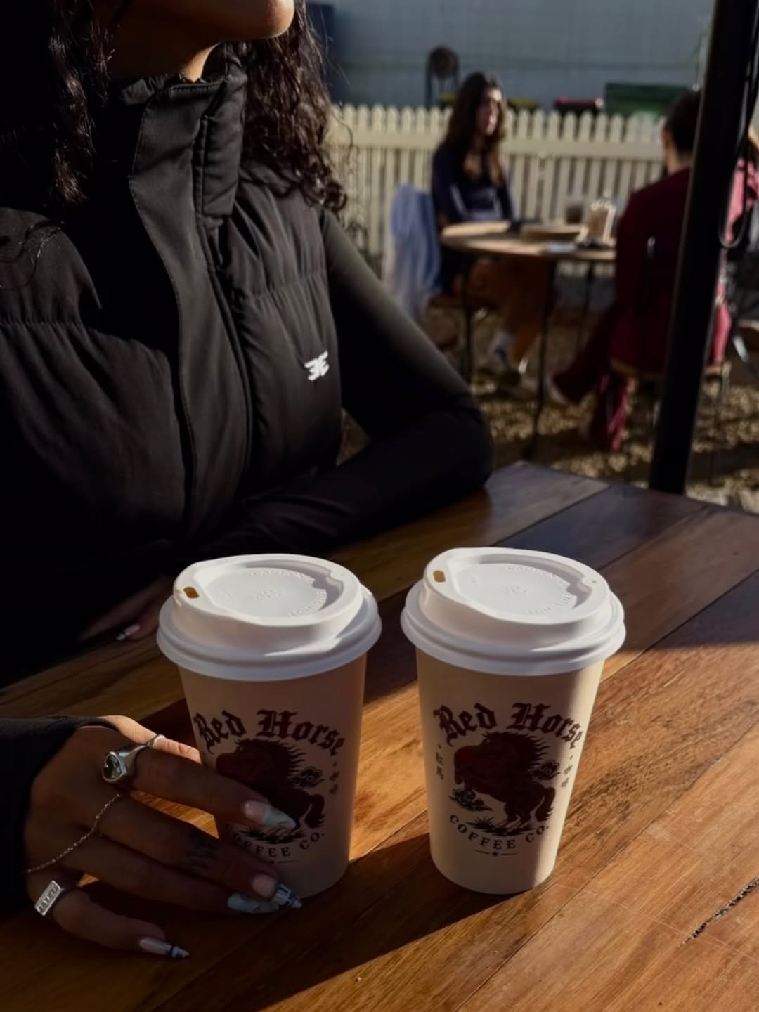 Two Red Horse coffee cups in morning sunlight